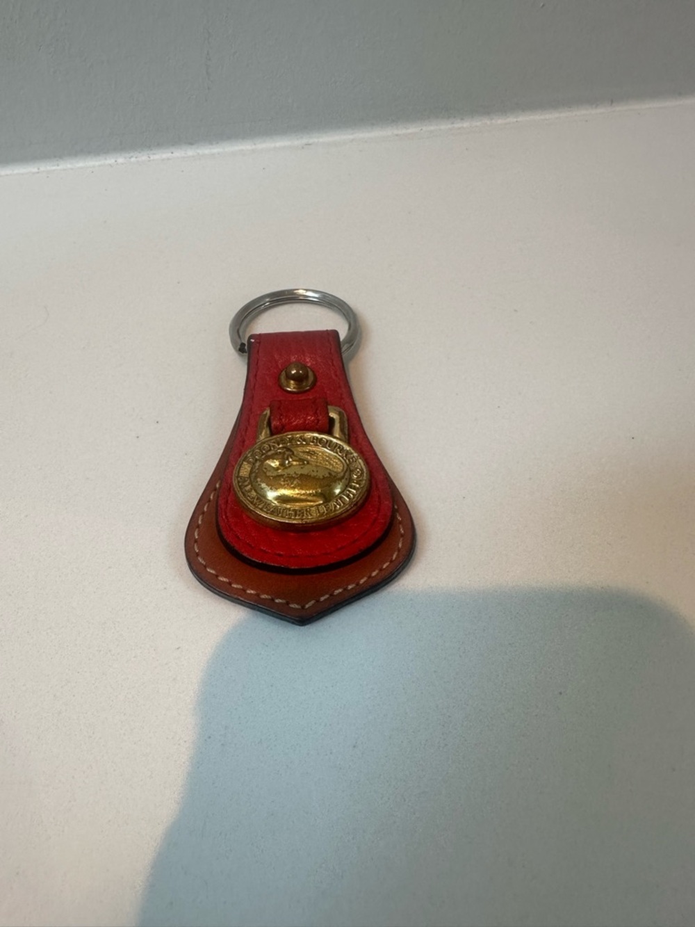 Dooney & Burke Leather Key Fob w/ Red and Brown Accent and Brass Duck medallion.